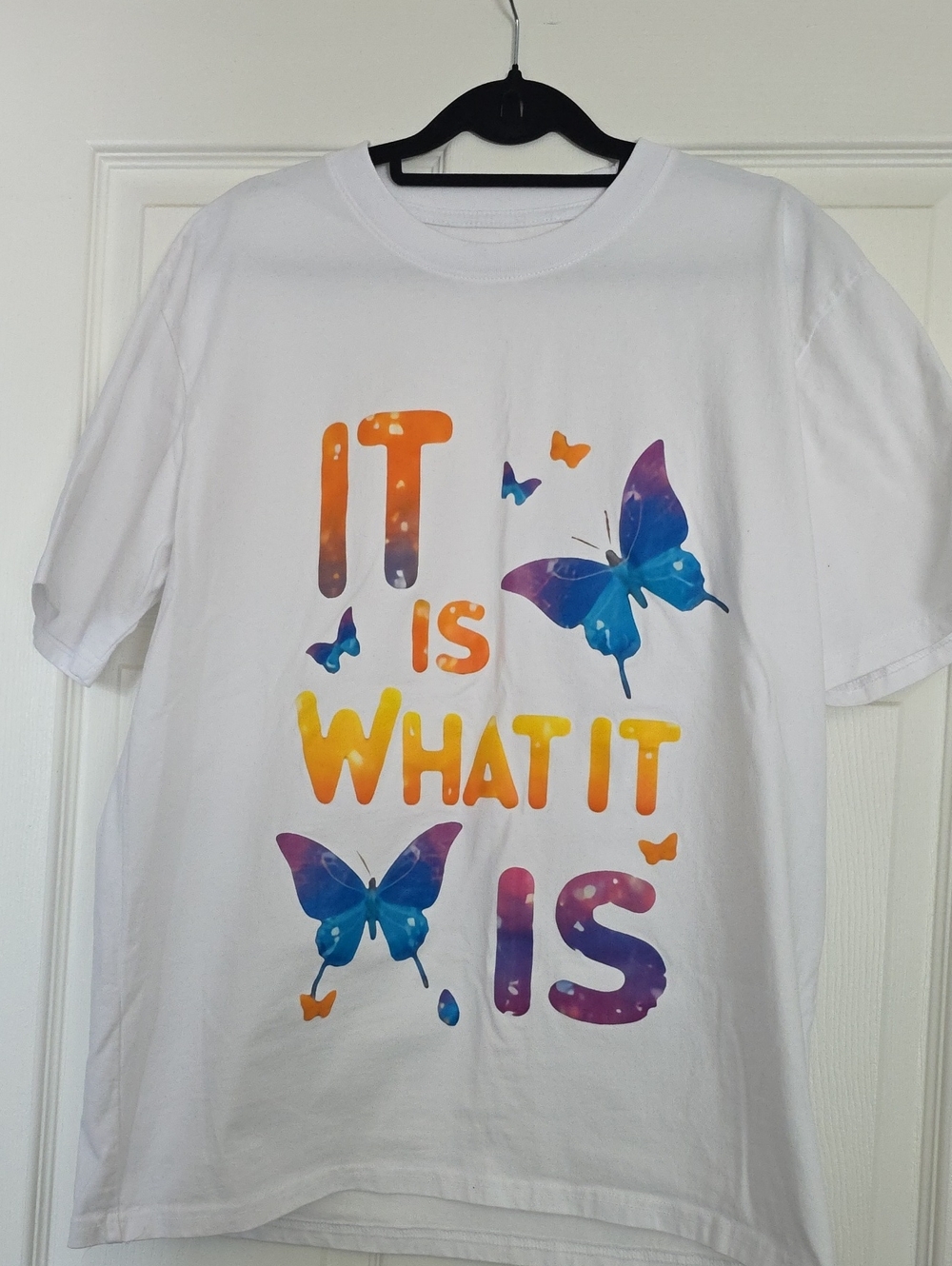 White Women's T-Shirt with Multicolor Butterfly Print - "It Is What It Is"